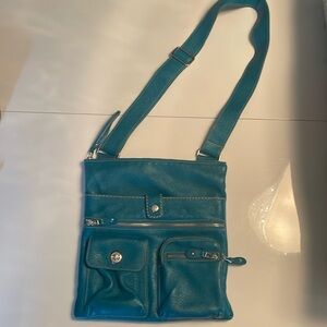 Blue leather roots shoulder bag .